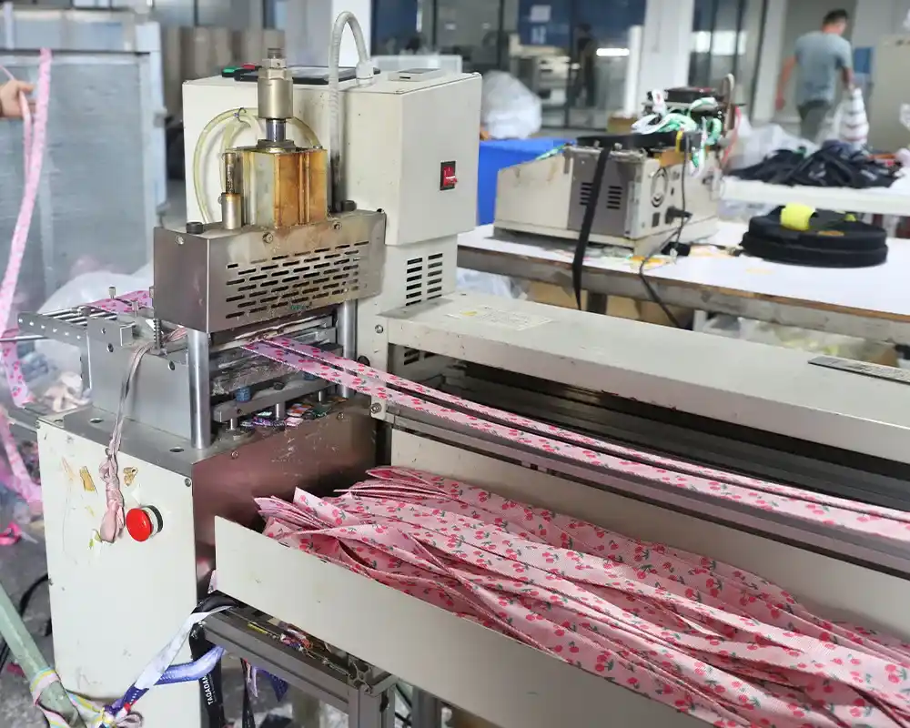 Precision thermal cutting of webbing at the factory, ensuring high-quality custom dog collars.