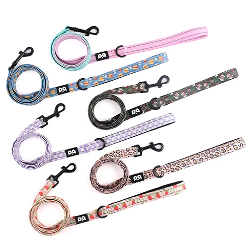 A high-quality, custom-patterned dog leash held by a person, representing direct control over product and pricing.